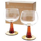 Two stemmed glasses with decorative amber-coloured bases.