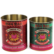 Set of retro-style storage tins with bold floral designs and a metallic finish.