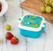 Turquoise plastic snack pot with cream and turquoise lid featuring print of cheetahs