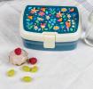Dark blue plastic lunch box with cream and dark blue lid featuring print of fairies amongst flowers
