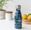 Small dark blue stainless steel water bottle with silver lid featuring pictures of sharks