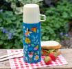 Small dark blue stainless steel flask with cream plastic cup featuring fairies amongst flowers