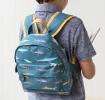 Mini backpack for kids with pictures of sharks worn by child