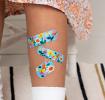 Light blue plasters with print of butterflies and flowers