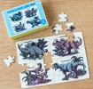 Small jigsaw puzzle with prints of dinosaurs being put together on table