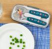 Stainless steel fork and spoon with dark blue plastic handles featuring print of fairies and flowers in plastic carry case on table