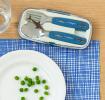 Stainless steel fork and spoon with dark blue plastic handles featuring with pictures of sharks in plastic carry case on table