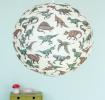 White paper lampshade with dinosaur decoration installed in room