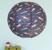 Dark blue paper lampshade with space rocket decoration installed in room
