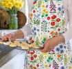 Wild Flowers Recycled Cotton Apron worn by adult holding baked goods