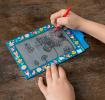 Child drawing on Fairies in the Garden Magic Slate