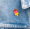 Ice lolly pin badge attached to piece of clothing