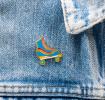 Roller skate pin badge attached to piece of clothing