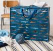 Sharks jumbo bag containing a throw alongside play ball and additional throws/rugs