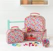 Tilde storage cases with hairbands, hairband lollipop and jewellery beads on table