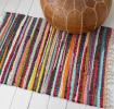 Handloomed multicoloured cotton rug