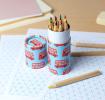 Tube of colouring pencils -TfL Routemaster Bus