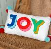 Embroidered cushion with pom poms - Joy