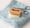 wooden nail brush featuring a sausage dog illustration