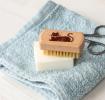 wooden nail brush featuring a cat illustration