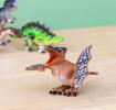 Pterodactyl wind up toy and a green Stegosaurus in the back