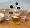 vinyl records and cassette tapes drink markers attached to glasses