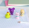 Four animal-shaped erasers in different colours.
