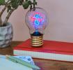 Mushroom usb light bulb placed on a book with light on