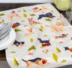 Cotton tea towel featuring an illustration of various dog breeds in playful poses