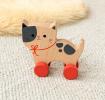 wooden push-along cat toy with red wheels