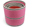 Stacked woven storage baskets in varying sizes and colours 