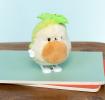 Plush avocado-shaped wind-up toy with green leaves 