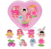Assorted colourful rings with animal, mermaid, flower, and fruit designs in a pink heart-shaped box
