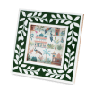 Square green picture frame with white leaf patterns on the border.