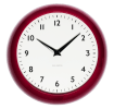 Round red wall clock with black hands and numbers,