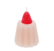Pink jelly-shaped candle topped with a decorative red strawberry.
