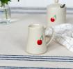Stoneware milk jug featuring cherry print with handle 