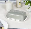 Rectangular butter dish with grey lid embossed with the word 'BUTTER