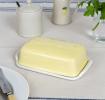 Rectangular butter dish with yellow lid embossed with the word 'BUTTER