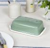 Rectangular butter dish with green lid embossed with the word 'BUTTER