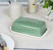 Rectangular butter dish with green lid embossed with the word 'BUTTER