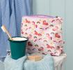 Wash bag in pale pink featuring colourful illustrations of unicorns, rainbows and stars with tag