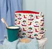 wash bag in white featuring colourful illustrations of sausage dog 
