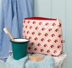 Wash bag in pink featuring colourful illustrations of red cherry print 