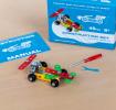 Completed colourful racing car model displayed with its packaging box