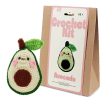 Avocado crochet kit with packaging and finished crocheted avocado beside it