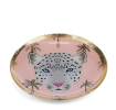 Round trinket dish with gold rim, pink background, palm tree pattern, and a leopard face design