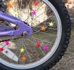 star-shaped bicycle spoke in different colour fixed in bicycle spoke