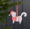 Wooden Christmas decoration of grey cat wearing festive jumper and hat hanging on tree
