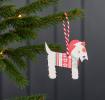 Wooden Christmas decoration of Scottie dog wearing festive jumper and hat hanging on tree